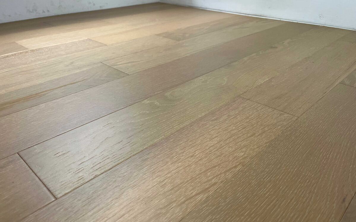Sunlit interior featuring natural hardwood flooring