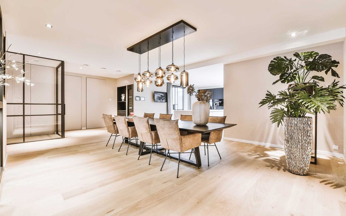 Bright dining room with light wood-look laminate flooring