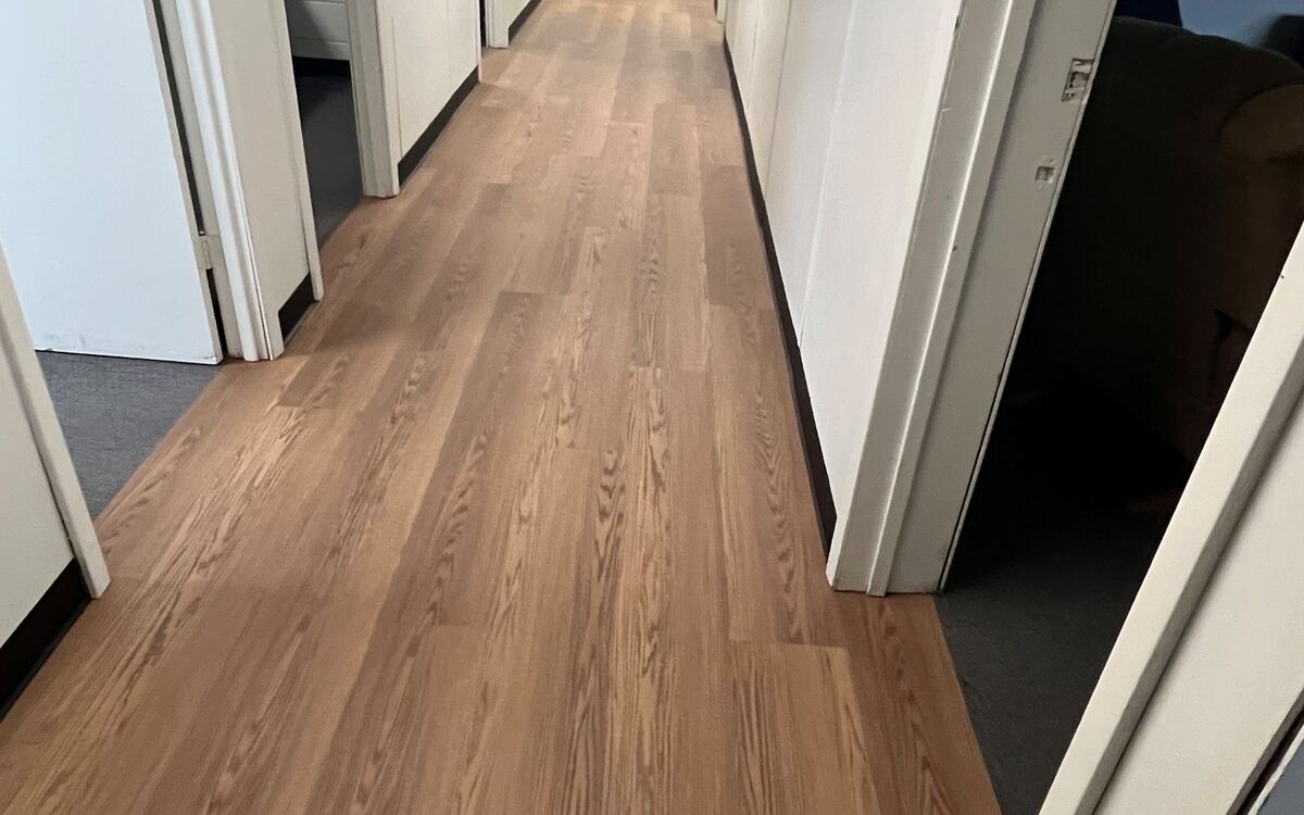 Installed wood-look loose-lay plank flooring
